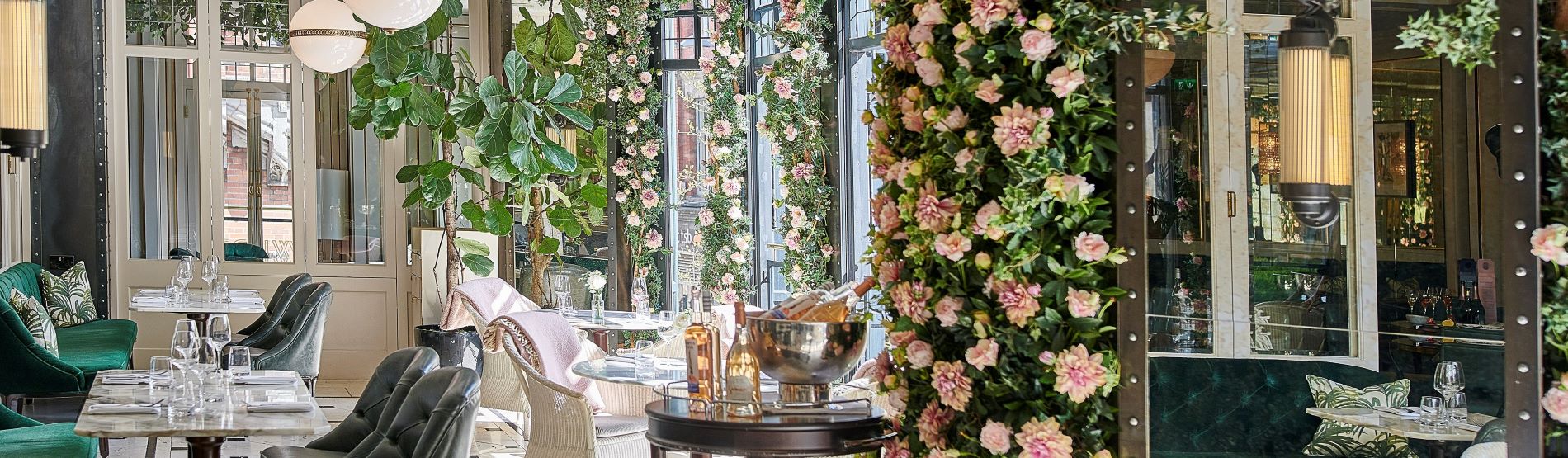 Wilde Restaurant decorated with pink roses and bottles of Rose wine