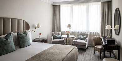 bed & seating area in a room at The Westbury hotel in Dublin