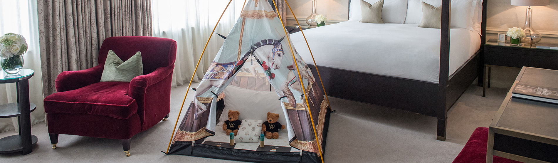 a tepee set up in a room with a Four Poster bed in The Westbury hotel in Dublin