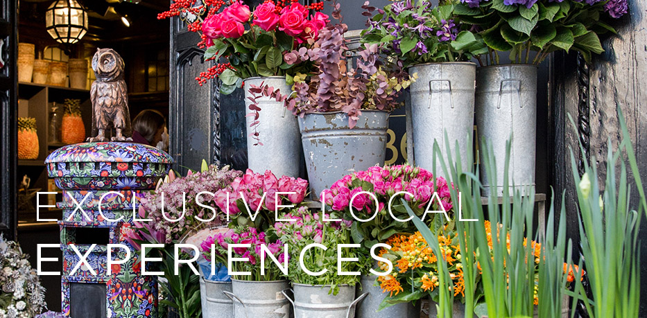 floral arrangement with text overlayed saying Exclusive Local Experiences