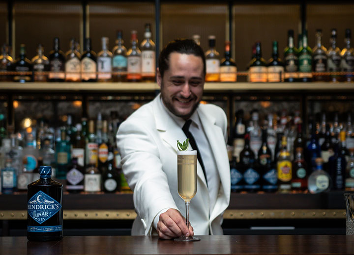 Bar tender serving a cocktail