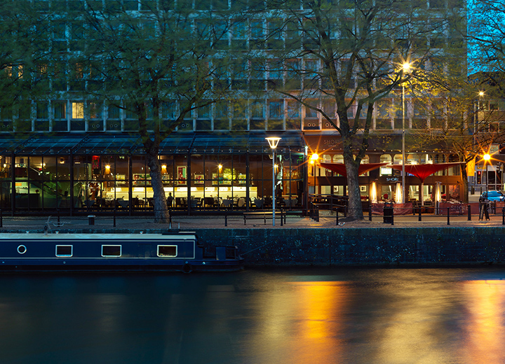 The Bristol hotel at night viewed from the harbour