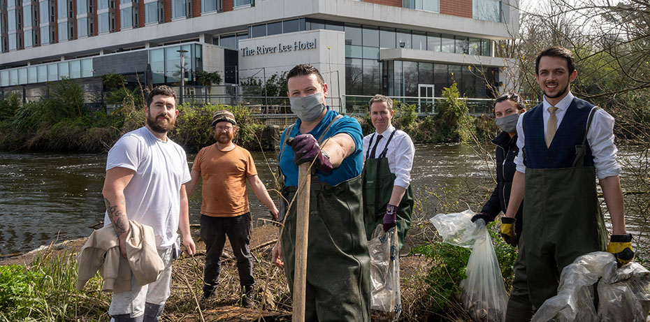 Staff from The River Lee planting willow trees along the river