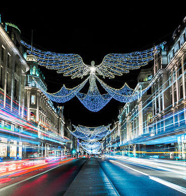 Christmas lights over a busy London street