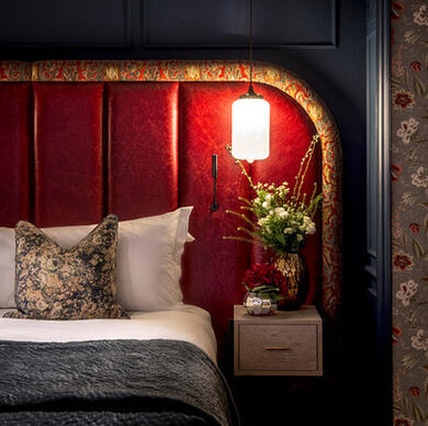 Luxury Studio Suite with red headboard at The Bloomsbury