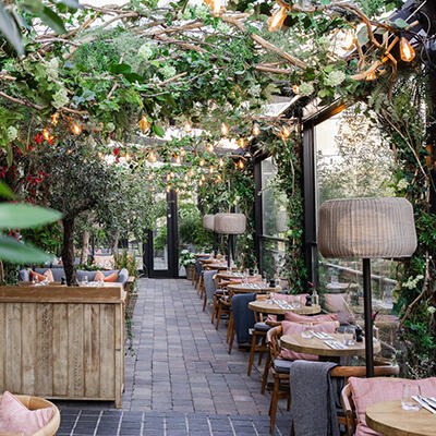 River Club Bar and Terrace decked out for the summer season with twinkling lights and summer decorations.