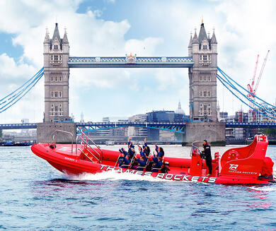 a Thames Rocket speedboat with London Bridge in the background