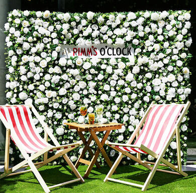 deck chairs in front of a sign saying pimms o'clock at The Refinery